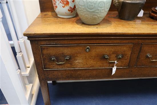 A George III oak dresser base, W.7ft 8in. D.1ft 7in. H.3ft 2in.